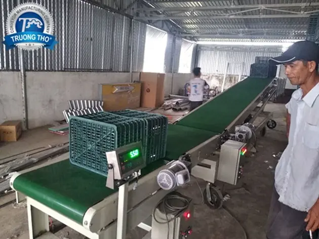 băng tải cân và tải lên xe